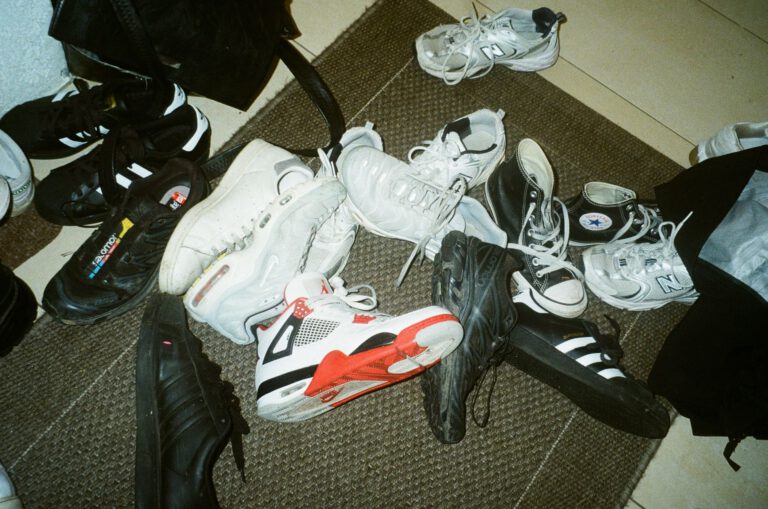 a pile of sneakers and shoes